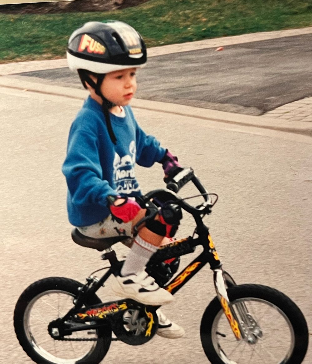Michael as a kid riding his bike
